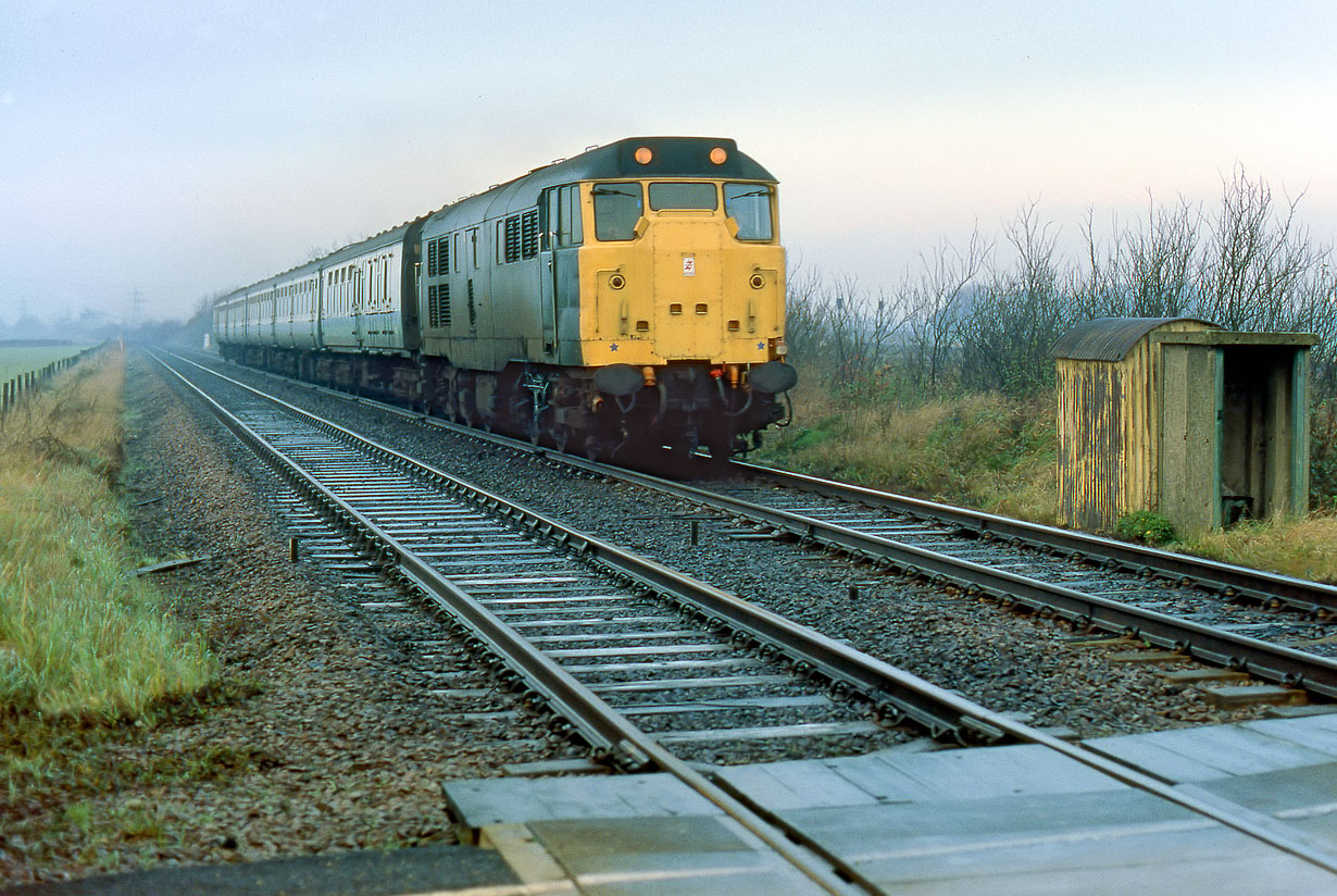 31443 Helpston (Maxey Level Crossing) 8 December 1984